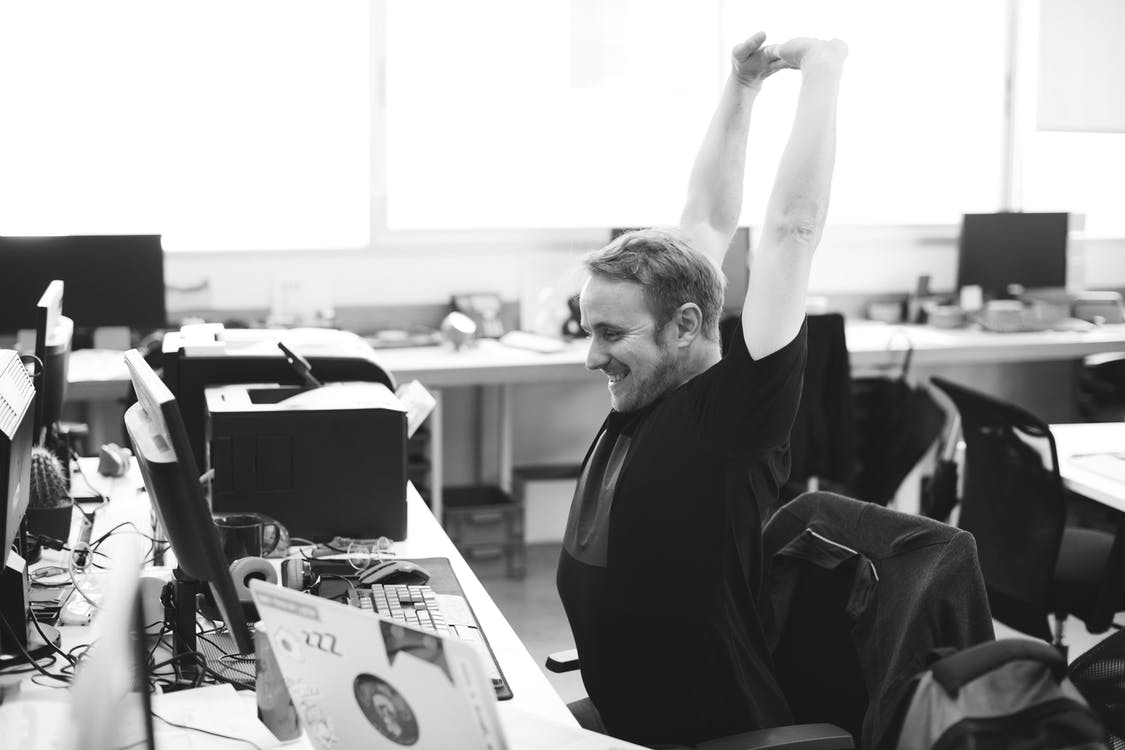 Man stretching after spending a long period at desk